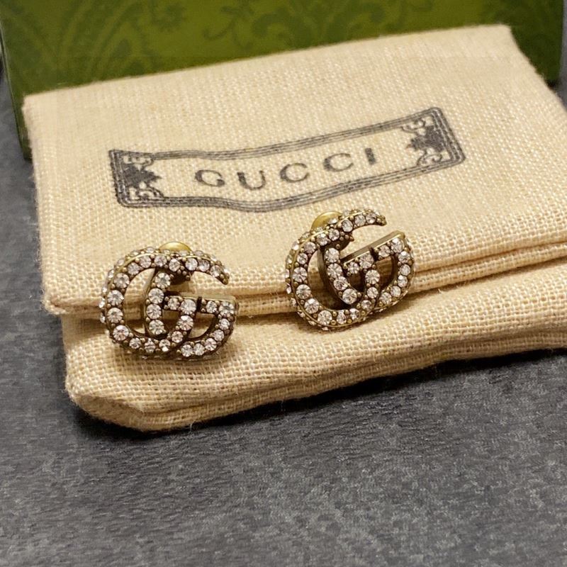 G*u*i earrings